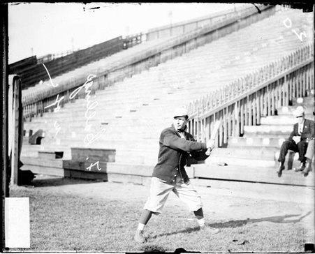 University of Chicago baseball player F. Callings standing in a batting stance at Marshall Field - Chicago Daily News, Inc.
