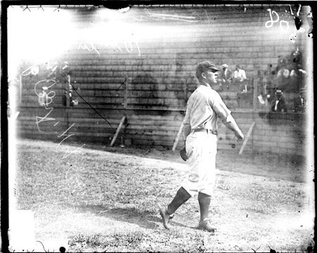 Baseball player Port, New York, following through after throwing a baseball at South Side Park - Chicago Daily News, Inc.