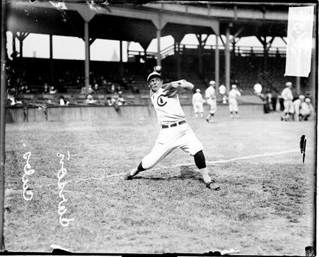 Baseball player Carson, Chicago Cubs, throwing a baseball, standing on the field at West Side Grounds - Chicago Daily News, Inc.