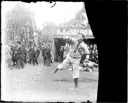 Baseball player Mordecai Brown, Chicago Cubs, following through after throwing a baseball at South Side Park - Chicago Daily News, Inc.