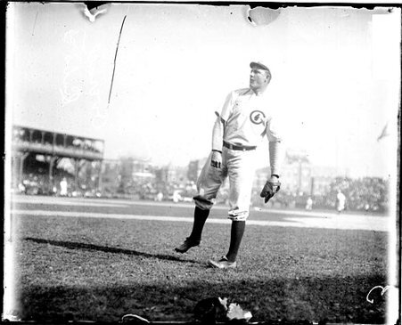 Baseball player O. Overall, Chicago Cubs, following through after throwing a baseball at West Side Grounds - Chicago Daily News, Inc.