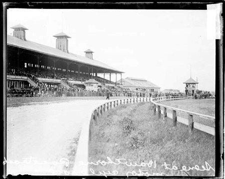 Crowds standing in the concourse area and sitting in grandstands at Hawthorne Race Track - Chicago Daily News, Inc.