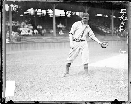 Baseball player H. Hyatt, Pittsburgh Pirates, holding a baseball in his gloved left hand at West Side Grounds - Chicago Daily News, Inc.
