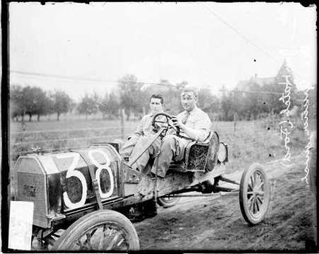 Automobile driver J. Hatch and automobile mechanic William Gruner sitting in a Ford automobile in Elgin - Chicago Daily News, Inc.