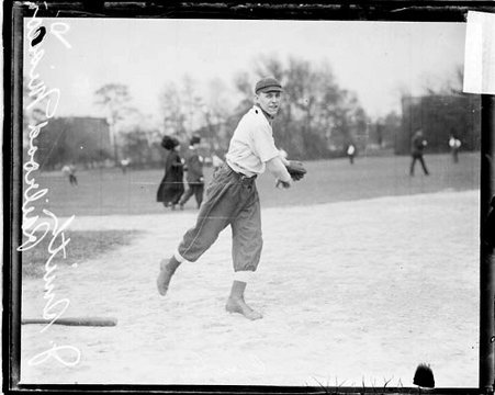 Railroad Mission baseball player J. Smith following through after throwing a baseball, standing on a baseball field - Chicago Daily News, Inc.