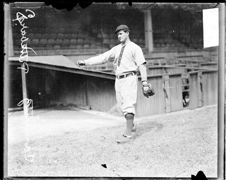 Baseball player Camnitz, Pittsburgh, following through after throwing a baseball at West Side Grounds - Chicago Daily News, Inc.
