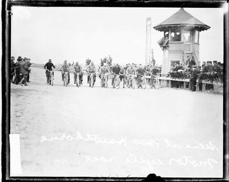 Motorcycle racers ready to race, sitting atop motorcycles at the starting line of a motorcycle race Hawthorne Race Track - Chicago Daily News, Inc.