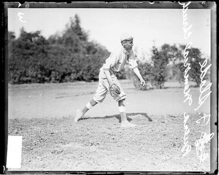 Buena Memorial Church baseball player F. Slade following through after throwing a baseball - Chicago Daily News, Inc.