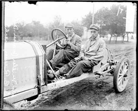 Automobile mechanics A. W. Miller and L. B. Reeves sitting in a Warren-Detroit automobile parked on a dirt road in Elgin - Chicago Daily News, Inc.