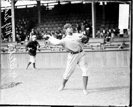 Baseball player Art Fletcher, New York Giants, standing in front of grandstands on the field at West Side Grounds - Chicago Daily News, Inc.