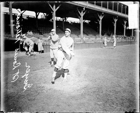 Baseball player Guyer, St. Louis Cardinals, following through after throwing a baseball at West Side Grounds - Chicago Daily News, Inc.