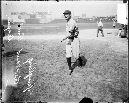 Baseball player Yingling, Cleveland Naps, following through after throwing a baseball on the field at Comiskey Park - Chicago Daily News, Inc.