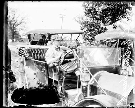 Automobile driver C G Sincabaugh sitting in the driver's seat of a Simplex automobile during the Algonquin Hill Climbing Contest - Chicago Daily News, Inc.