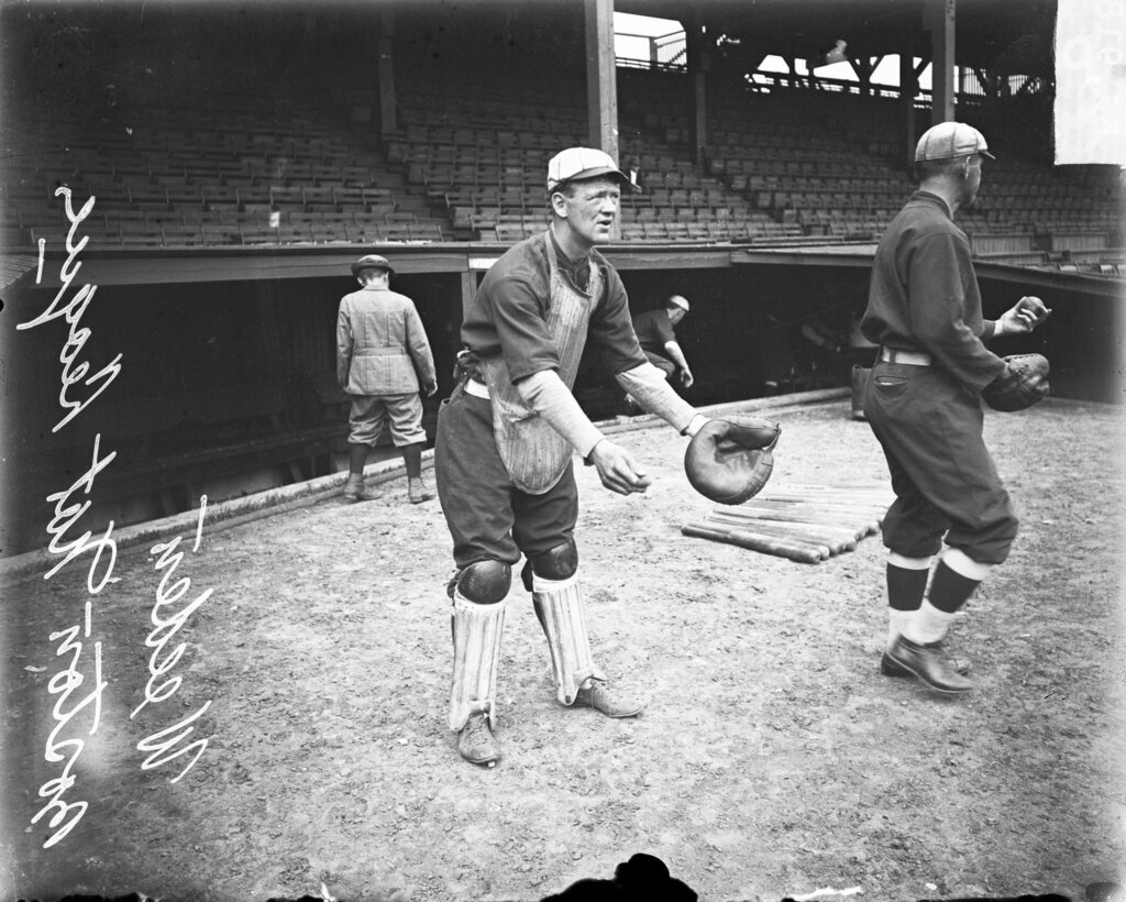 Catcher Weeden, Boston Beaneaters, holding his hands in front of him on the field at West Side Grounds - Chicago Daily News, Inc.