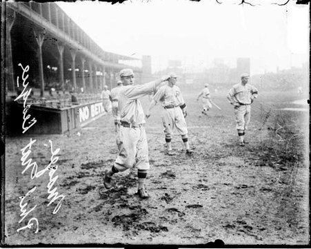 Baseball player Magee, Philadelphia Phillies, following through after throwing a baseball on the field at West Side Grounds - Chicago Daily News, Inc.
