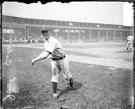 Baseball player Juul, Chicago Cubs, following through after throwing a baseball, standing on the field at West Side Grounds - Chicago Daily News, Inc.