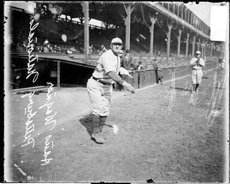 Baseball player Wagner, Pittsburgh Pirates, standing in front of grandstands at West Side Grounds - Chicago Daily News, Inc.