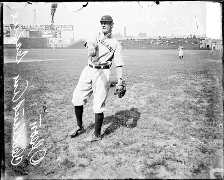 Baseball player Olson, Cleveland Naps, following through after throwing a baseball on the field at Comiskey Park - Chicago Daily News, Inc.