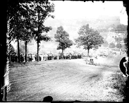 Automobile driver Lanahan driving a Ford Model T #2 up a dirt road on a hill during the Algonquin Hill Climbing Contest - Chicago Daily News, Inc.