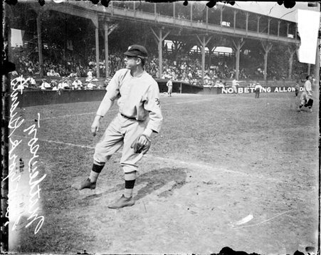 Baseball player Mathewson, New York Giants, following through after throwing a baseball on the field at West Side Grounds - Chicago Daily News, Inc.