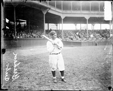 Baseball player Richter, Chicago Cubs, holding a baseball bat, standing on the field at West Side Grounds - Chicago Daily News, Inc.