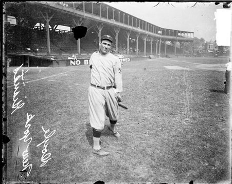 Baseball player Doyle, New York Giants, following through after swinging a baseball bat on the field at West Side Grounds - Chicago Daily News, Inc.