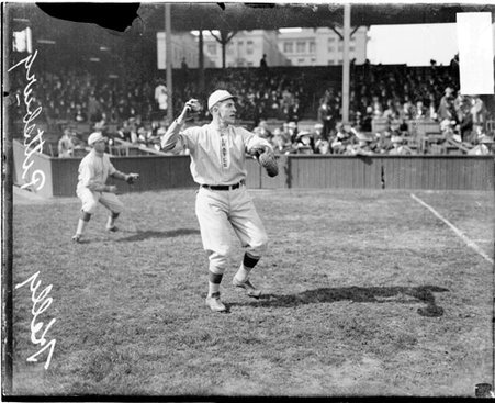 Baseball player Kelly, Pirates, cocking his arm to throw a baseball at West Side Grounds - Chicago Daily News, Inc.