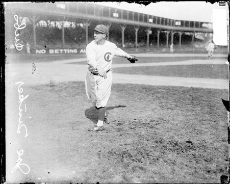 Baseball player Joe Tinker, Cubs, following through after throwing a baseball at West Side Grounds - Chicago Daily News, Inc.