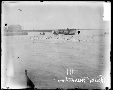 Swimmers swimming in the Chicago River, during a 1911 river swimming marathon - Chicago Daily News, Inc.