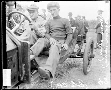 Automobile driver, Morris and mechanic Keppner sitting in a Cole automobile parked outdoors in Elgin, during an automobile race - Chicago Daily News, Inc.