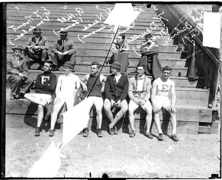 High school athletes, Trout, Hill, Heiss, Dewees, and Bachman sitting on the first row of bleachers - Chicago Daily News, Inc.