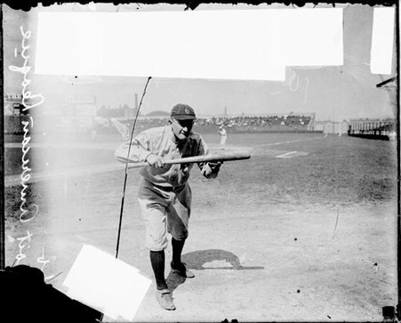Baseball player, Ty Cobb, Detroit Tigers, holding a baseball bat, standing in a batting stance on the field at Comiskey Park - Chicago Daily News, Inc.