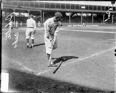 Baseball player Frank Schulte, Cubs, holding a baseball bat on the field at West Side Grounds - Chicago Daily News, Inc.