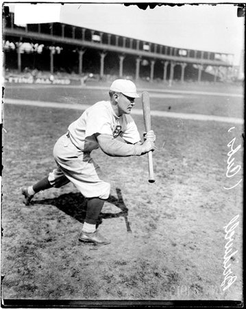 Baseball player, Bridwell, Cubs, standing in a bunting stance on the field at West Side Grounds - Chicago Daily News, Inc.