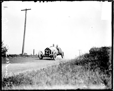 Automobile driver Gil Anderson driving a Stutz automobile during Elgin Auto Races - Chicago Daily News, Inc.