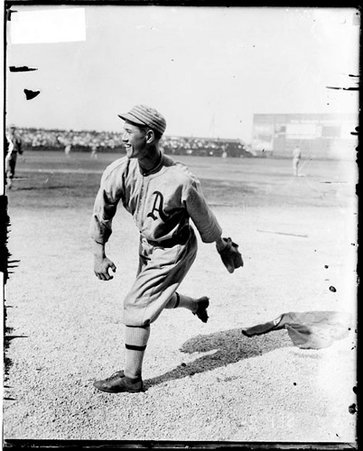 Baseball player Joe Bush, Philadelphia Athletics, following through after throwing a baseball on the field at Comiskey Park - Chicago Daily News, Inc.