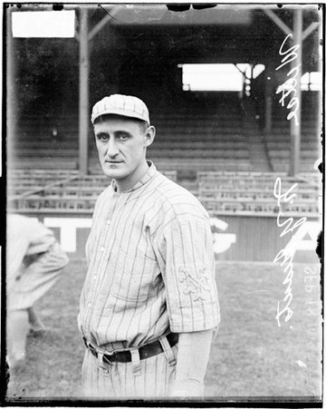 Baseball player George Wiltse, Giants, standing in front of grandstands on the field at West Side Grounds - Chicago Daily News, Inc.