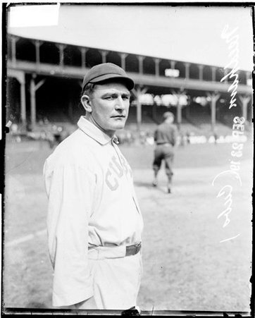 Baseball player, Needham, Cubs, standing on the field at West Side Grounds, another player is standing in the background - Chicago Daily News, Inc.