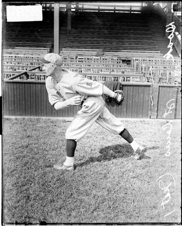Baseball player, Doak, St Louis Cardinals, following through after throwing a baseball at West Side Grounds - Chicago Daily News, Inc.