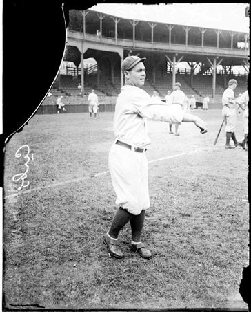 Baseball player, Keating, Cubs, following through after throwing a baseball at West Side Grounds - Chicago Daily News, Inc.