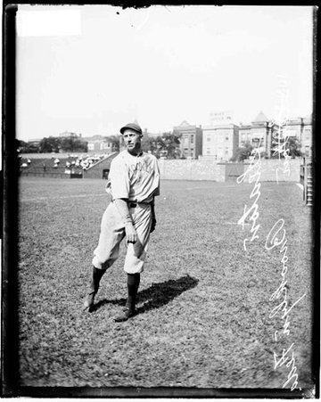 Brooklyn Federal League baseball player, Seaton following through after throwing a baseball on the field at Weeghman Park - Chicago Daily News, Inc.