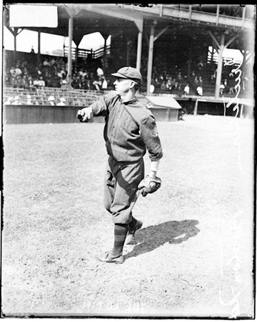 Baseball player, Crutcher, Boston Braves, following through after throwing a baseball at West Side Grounds - Chicago Daily News, Inc.