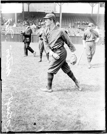 Baseball player, Kraft, Boston Braves, throwing a baseball, in front of grandstands on the field at West Side Grounds - Chicago Daily News, Inc.