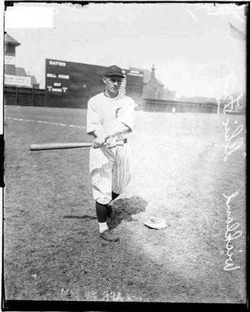 Baseball player, Wickland, Whales, swinging a baseball bat into a follow-through position on the field at Weeghman Park - Chicago Daily News, Inc.