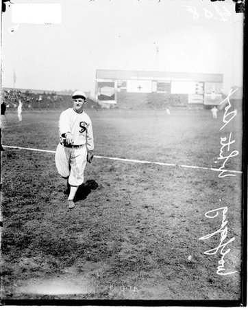 Baseball player, Wolfgang, White Sox, following through after throwing a baseball, standing on the field at Comiskey Park - Chicago Daily News, Inc.