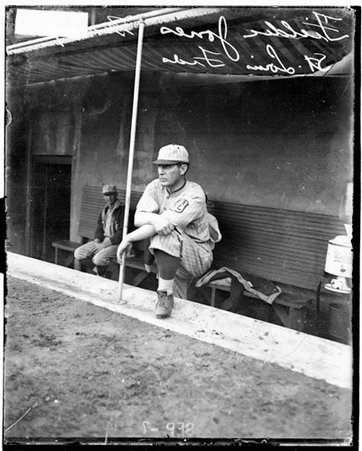 St Louis baseball player Fielder Jones, standing in a dugout at Weeghman Park - Chicago Daily News, Inc.