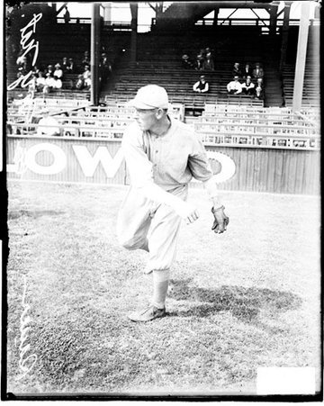 Baseball player, Sauer, New York Giants, following through after throwing a baseball at West Side Grounds - Chicago Daily News, Inc.