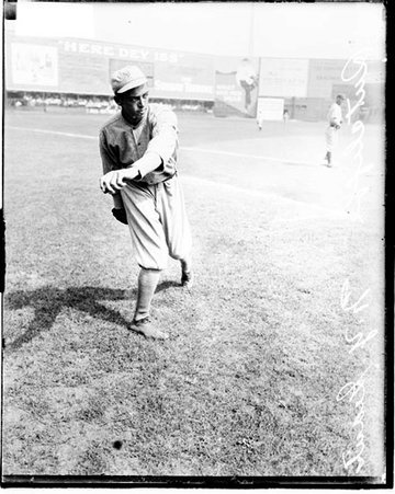 Baseball player, Sutcliffe, New York Giants, following through after throwing a baseball on the field at West Side Grounds - Chicago Daily News, Inc.