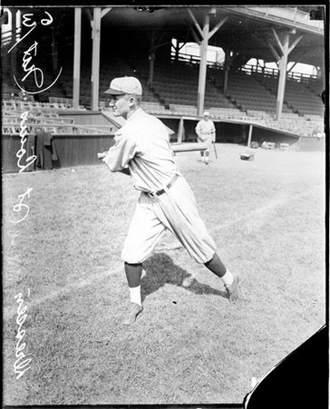 Baseball player, Dressen, St Louis Cardinals, following through after swinging a baseball bat on the field at West Side Grounds - Chicago Daily News, Inc.