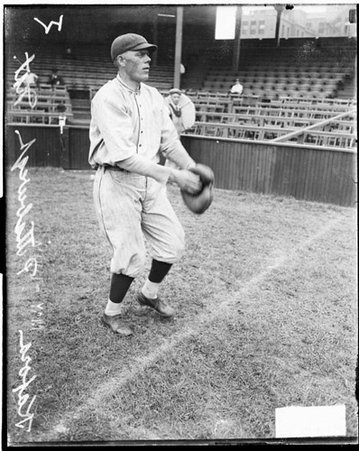 Baseball player, Kafora, Pirates, standing in front of grandstands on the field at West Side Grounds - Chicago Daily News, Inc.